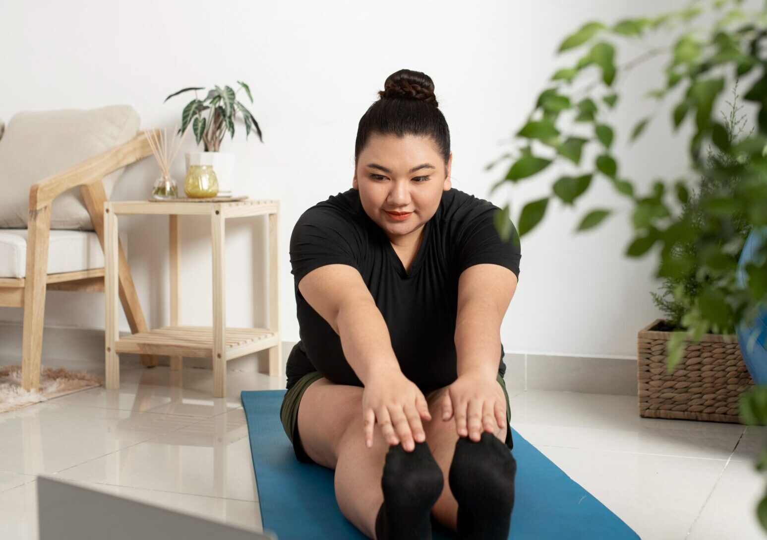 woman-following-online-fitness-instructor